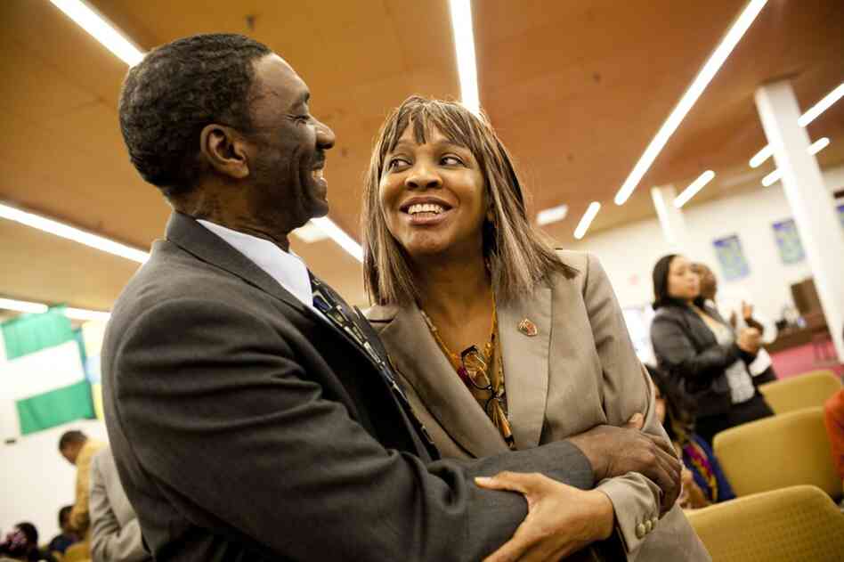 Natasha embraces her husband, Curtis, after Sunday worship at The Sanctuary Baptist church. "I love Curtis," Nicholas says. "He keeps a roof over our heads and keeps us laughing."