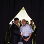 Rep. Ron Paul, R-Texas (right), talks with chief strategist Jesse Benton in Ames, Iowa, on Aug. 13.