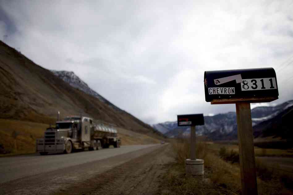 A water truck drives down a rural road in Colorado's vast Garfield County.