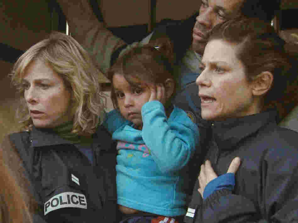 With Iris (Marina Fois, right) and Fred (Joey Starr), Nadine (Karin Viard) carries a Romanian child from a crime scene.