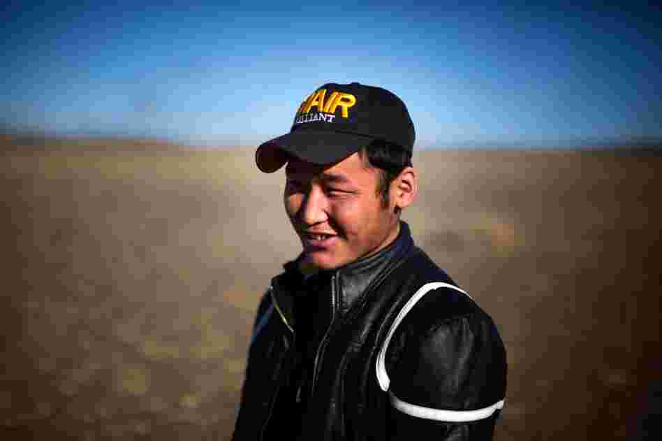 Uuganbaatar says does not miss the herding life of his father and enjoys the salary, friends and amenities at the mining camp.