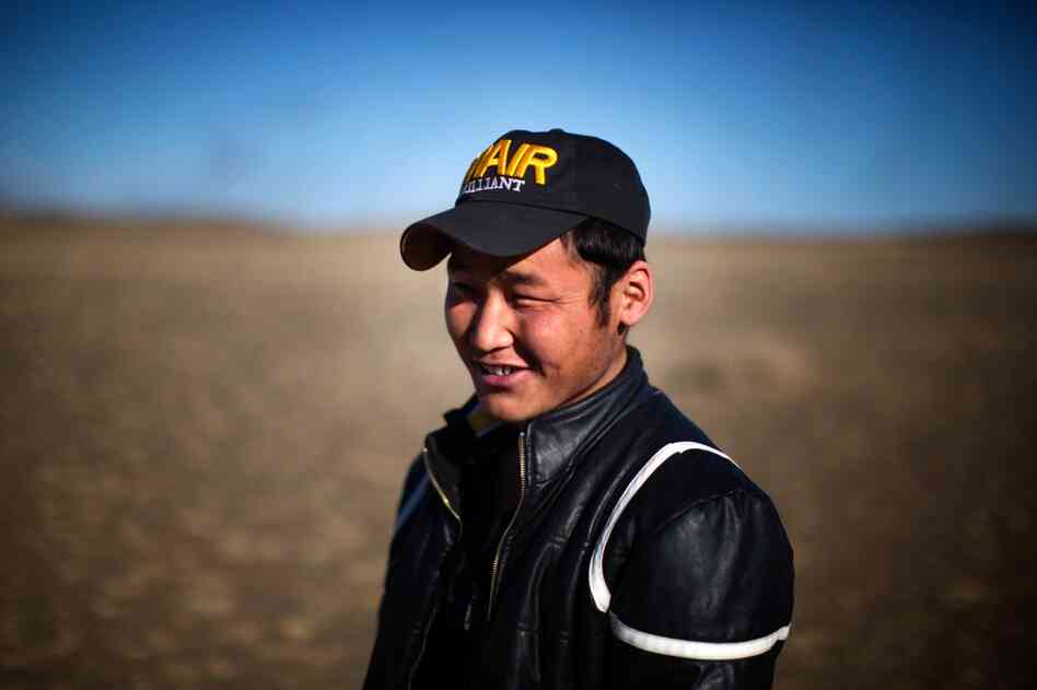Uuganbaatar says does not miss the herding life of his father and enjoys the salary, friends and amenities at the mining camp.