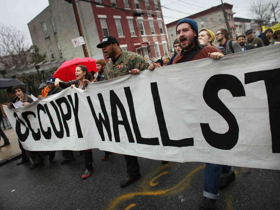 Occupy Wall Street protesters march through in an impoverished community in December 2011.
