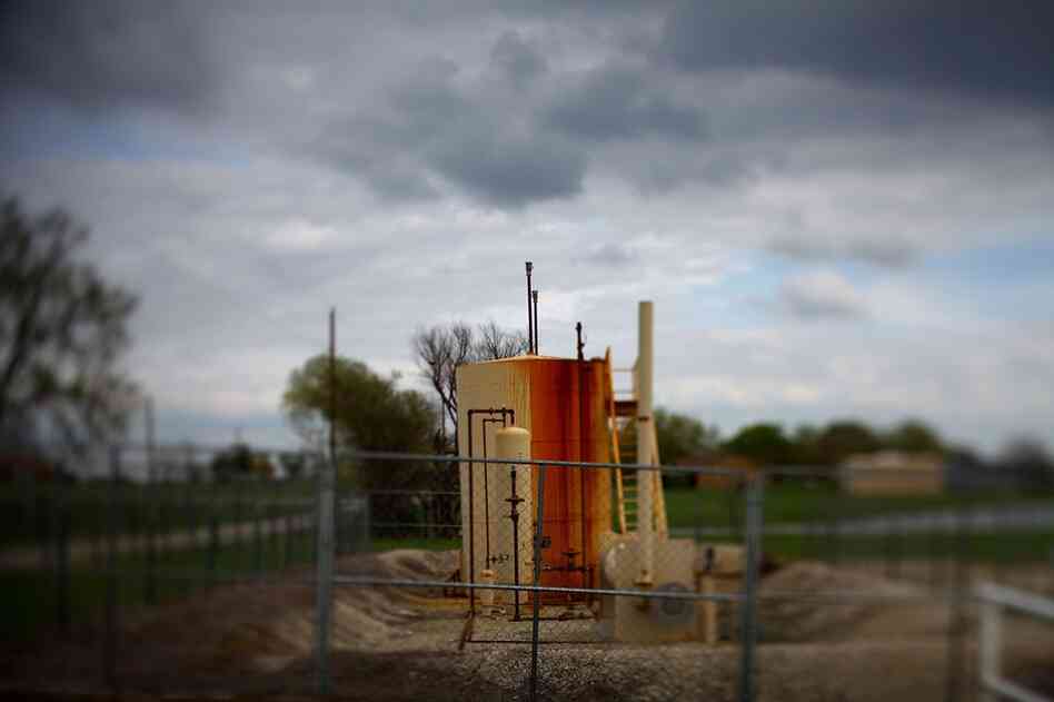 Signs of fracking, such as well heads, storage tanks and big rigs, are an ongoing presence in Dish.