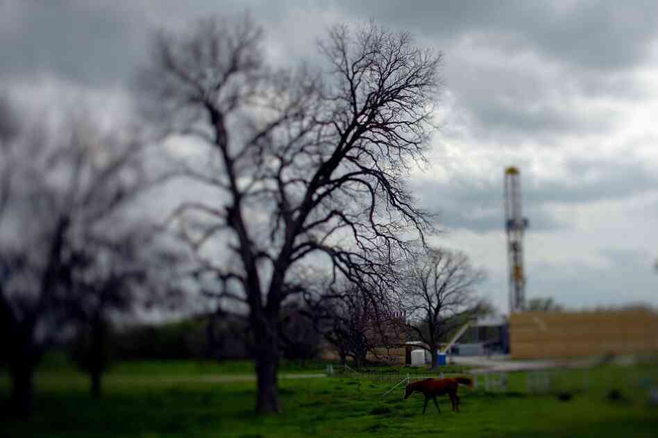 A drilling rig (right) marks the spot of an upcoming frack.