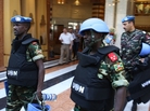 U.N. monitors in Syria leave their Damascus hotel on Wednesday on a mission. A day earlier, their U.N. colleagues were at the scene of a major clash in northern Syria that left more than 30 Syrians dead. U.N. monitors in Syria leave their Damascus hotel on Wednesday on a mission. A day earlier, their U.N. colleagues were at the scene of a major clash in northern Syria that left more than 30 Syrians dead.