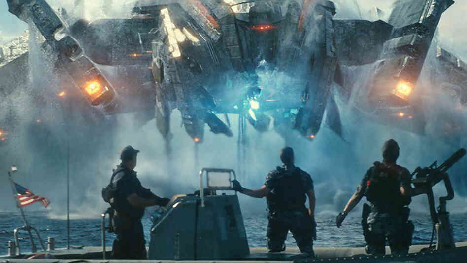 Beast (John Tui), Hopper (Taylor Kitsch) and Raikes (Rihanna) are stunned by the appearance of invading alien forces in the motion picture adaption of the, yes, board game Battleship. Beast (John Tui), Hopper (Taylor Kitsch) and Raikes (Rihanna) are stunned by the appearance of invading alien forces in the motion picture adaption of the, yes, board game Battleship.