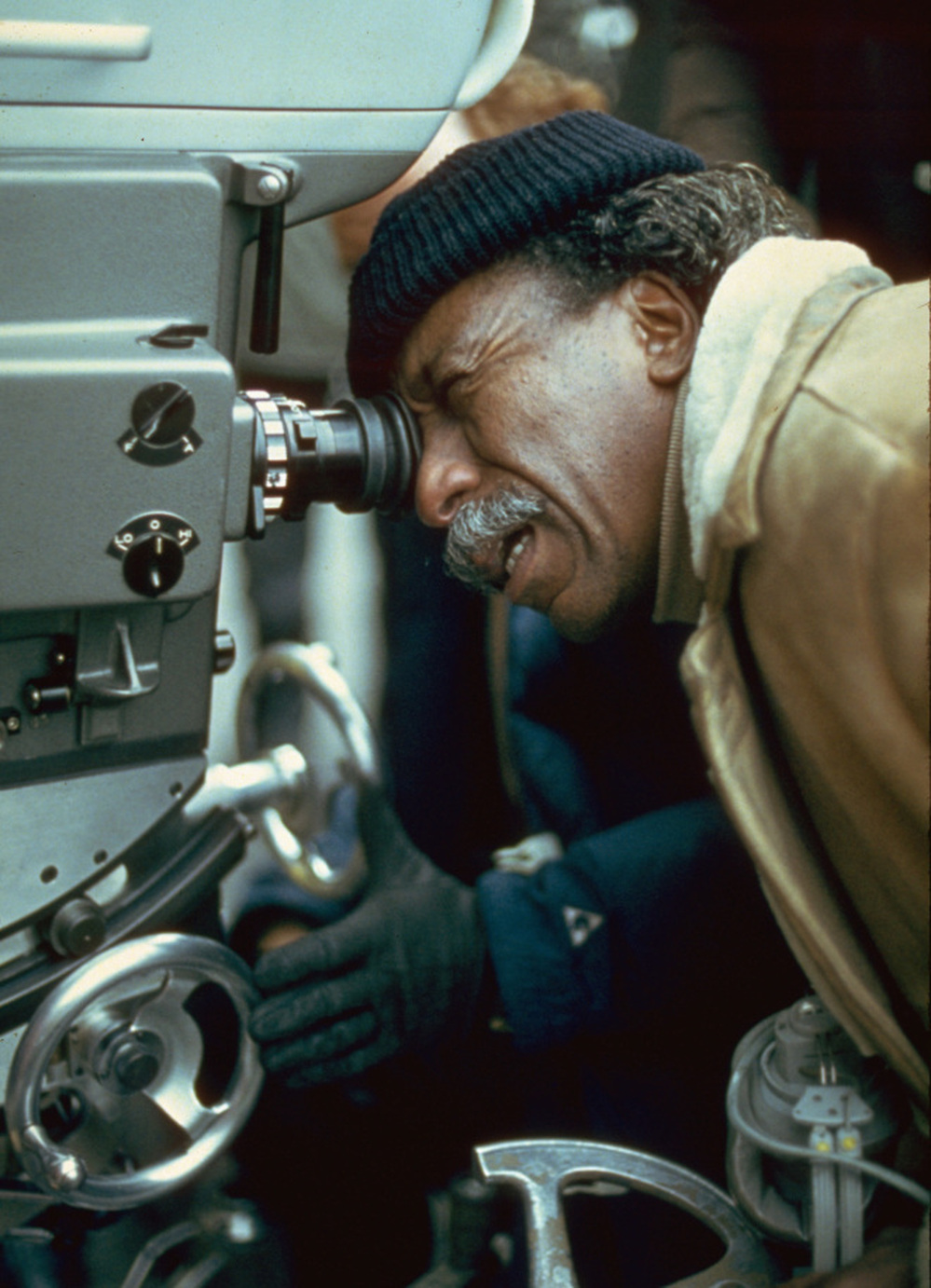 American film director and photographer Gordon Parks on the set of a film, circa 1971.