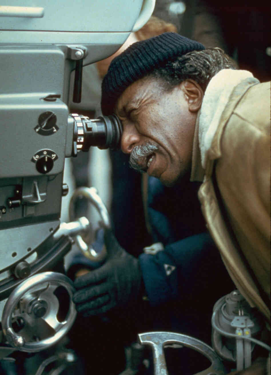American film director and photographer Gordon Parks on the set of a film, circa 1971.
