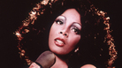 Disco singer Donna Summer singing on stage around 1975. Disco singer Donna Summer singing on stage around 1975.