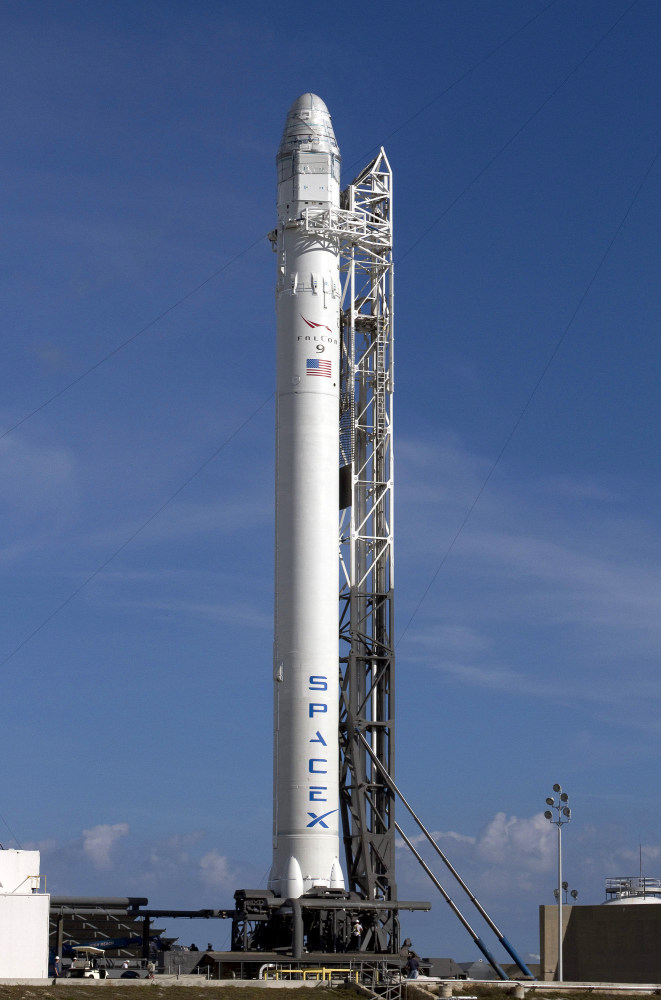 A SpaceX rocket waits to be launched at Cape Canaveral, Fla., in March. If all goes as planned, the private company's rocket will be the first commercial spacecraft to visit the International Space Station.