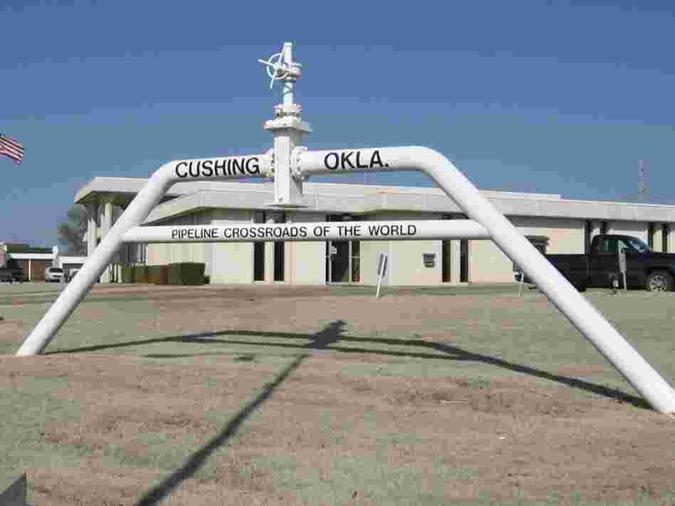 The U.S. oil boom has created a glut of crude in Cushing, Okla., a major oil storage hub. This sign dubs the city the "Pipeline Crossroads of the World."