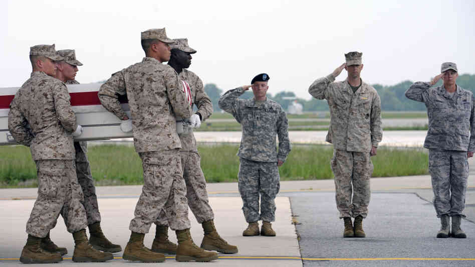 A Marine Corps team carries the remains of Marine Sgt. J.P. Huling, 25, of West Chester, Ohio, at Dover Air Force Base, Del., on May 9. Huling was killed three days earlier by an Afghan soldier in southern Afghanistan, one of a growing number of such shootings. A Marine Corps team carries the remains of Marine Sgt. J.P. Huling, 25, of West Chester, Ohio, at Dover Air Force Base, Del., on May 9. Huling was killed three days earlier by an Afghan soldier in southern Afghanistan, one of a growing number of such shootings.