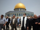 Egypt's grand mufti, Ali Gomaa (center, with scarf), visits the Al-Aqsa mosque in Jerusalem in April. The Dome of the Rock, which is part of the same compound, is shown behind him. Many Muslims have boycotted the site because Israel claims sovereignty. But Palestinian religious figures now say they welcome such visits, a move that has sparked controversy. Egypt's grand mufti, Ali Gomaa (center, with scarf), visits the Al-Aqsa mosque in Jerusalem in April. The Dome of the Rock, which is part of the same compound, is shown behind him. Many Muslims have boycotted the site because Israel claims sovereignty. But Palestinian religious figures now say they welcome such visits, a move that has sparked controversy.