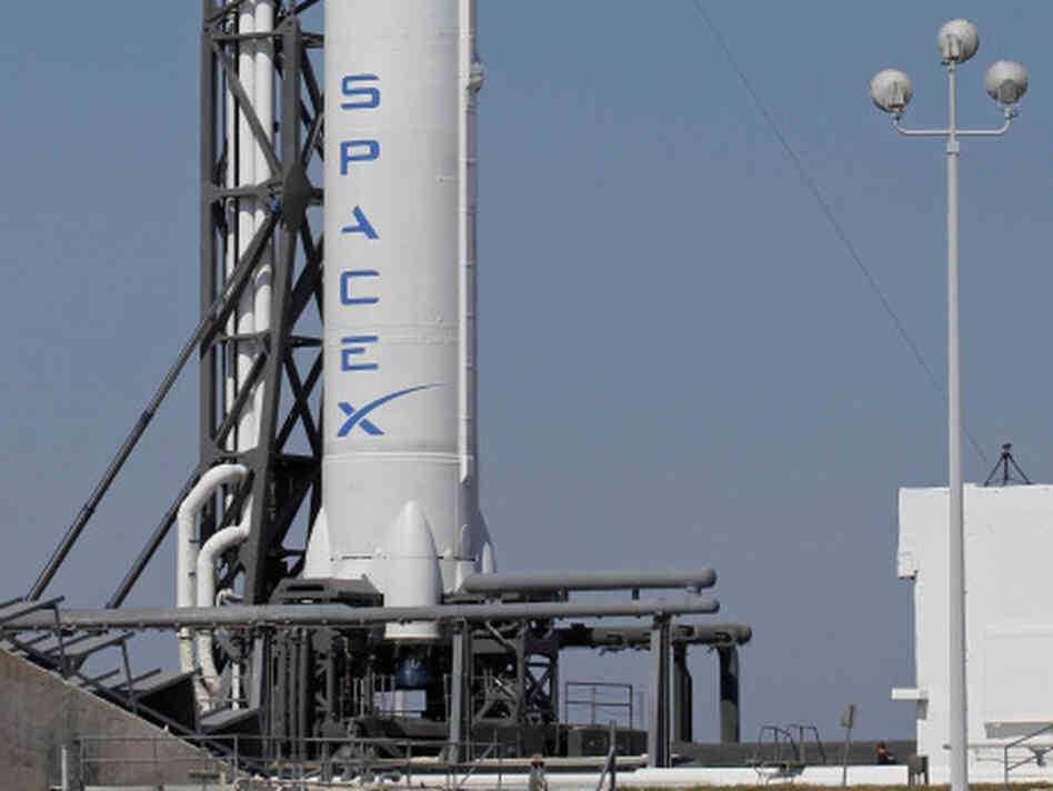 The Falcon 9 SpaceX rocket stands ready for launch at the Cape Canaveral Air Force Station in Florida. The Falcon 9 SpaceX rocket stands ready for launch at the Cape Canaveral Air Force Station in Florida.