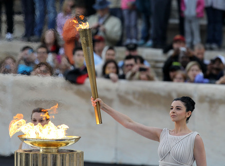 Actress Ino Menegaki, dressed as a high priestess, lights the torch at a ceremony in Panathinean stadium in Athens. Actress Ino Menegaki, dressed as a high priestess, lights the torch at a ceremony in Panathinean stadium in Athens.