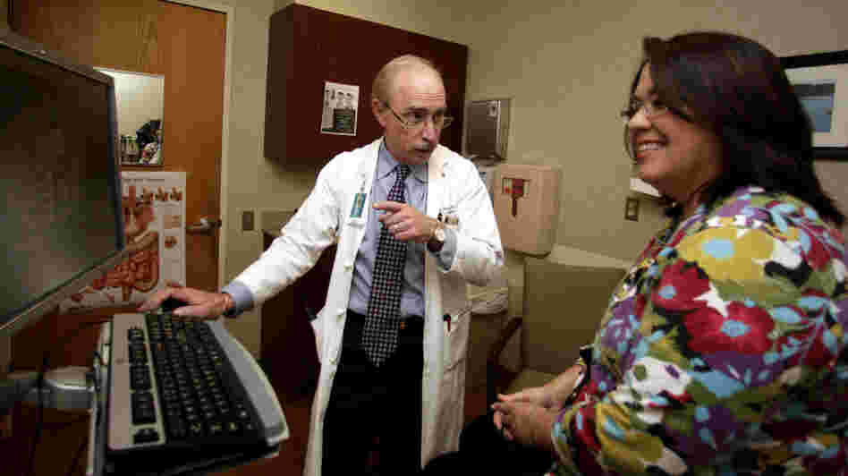 Dr. Paul J. Pockros, a liver specialist at Scripps Green Hospital in San Diego, talks with hepatitis C patient Loretta Roberts in Jan. 2011. Dr. Paul J. Pockros, a liver specialist at Scripps Green Hospital in San Diego, talks with hepatitis C patient Loretta Roberts in Jan. 2011.