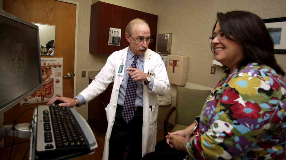 Dr. Paul J. Pockros, a liver specialist at Scripps Green Hospital in San Diego, talks with hepatitis C patient Loretta Roberts in Jan. 2011. Dr. Paul J. Pockros, a liver specialist at Scripps Green Hospital in San Diego, talks with hepatitis C patient Loretta Roberts in Jan. 2011.