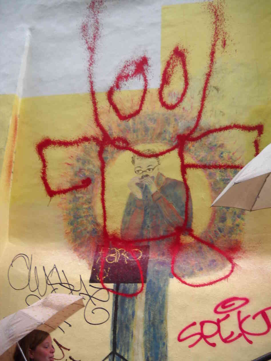 The graffiti-tagged mural near the childhood home of Toots Thielemans in Brussels.