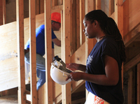 Cara Fuller, training director of the building program, says it's learning workplace etiquette, not construction skills, that is challenging for trainees.