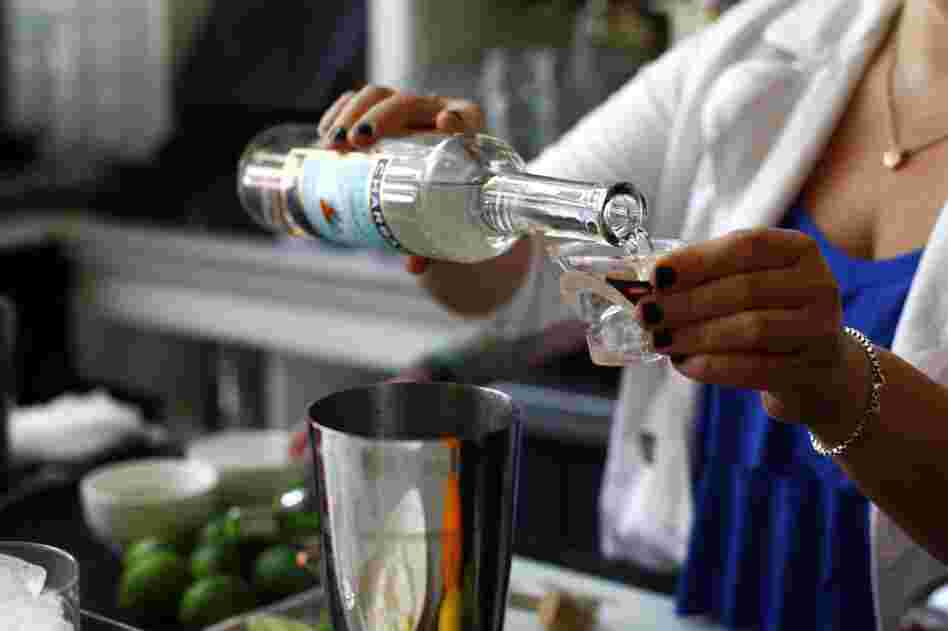 Add 1.5 ounces tequila, 1/2 ounce Cointreau and the juice of 1 lime, and shake.