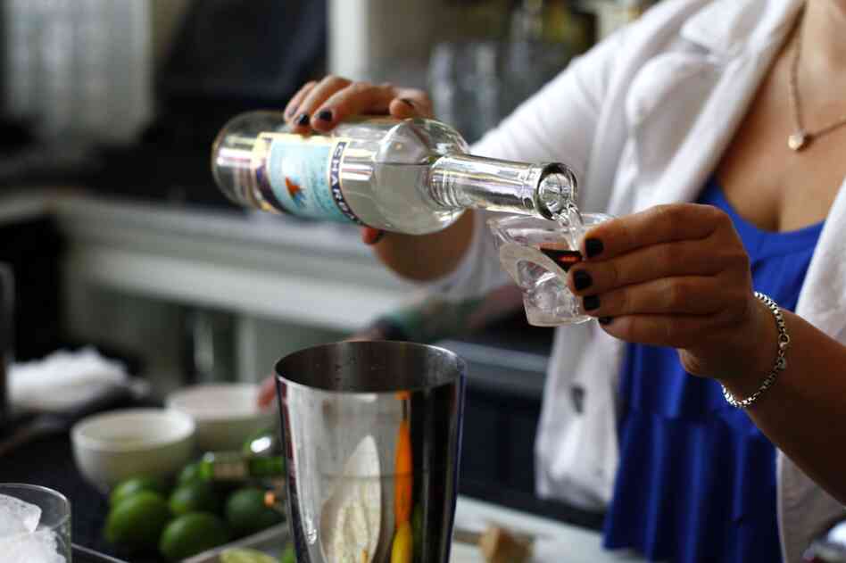 Add 1.5 ounces tequila, 1/2 ounce Cointreau and the juice of 1 lime, and shake.