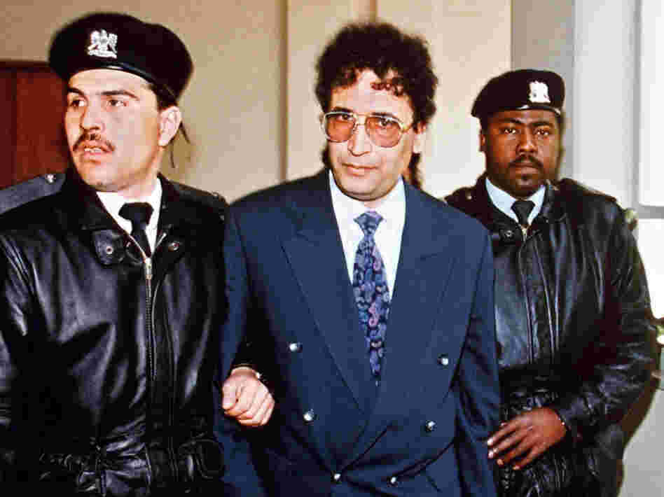 Security officers escort convicted Lockerbie bomber Abdel Baset al-Megrahi (center) in Tripoli in 1992.