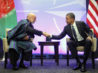 President Obama shakes hands with with Afghan President Hamid Karzai during their meeting at the NATO Summit in Chicago on Sunday. The summit, which continues Monday, is focusing heavily on Afghanistan's future.
