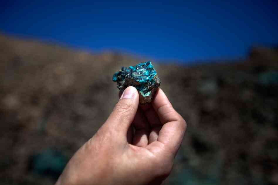 Oyu Tolgoi, a massive mine in Mongolia's South Gobi province, begins producing copper ore in June, 2012. Within five years, it's expected to become the world's third largest copper mine. An employee at Oyu Tolgoi — which means "Turquoise Hill" — holds up a chunk of oxidized copper.