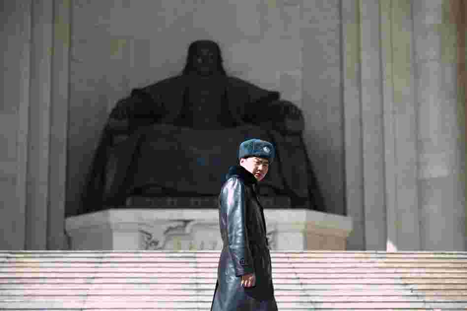 The Central Asian nation of Mongolia is undergoing vast change, thanks to a booming mining industry. A guard in Ulan Bator, the capital, surveys central Sukhbaatar Square; behind him stands a giant statue of Genghis Khan, the country's founder.