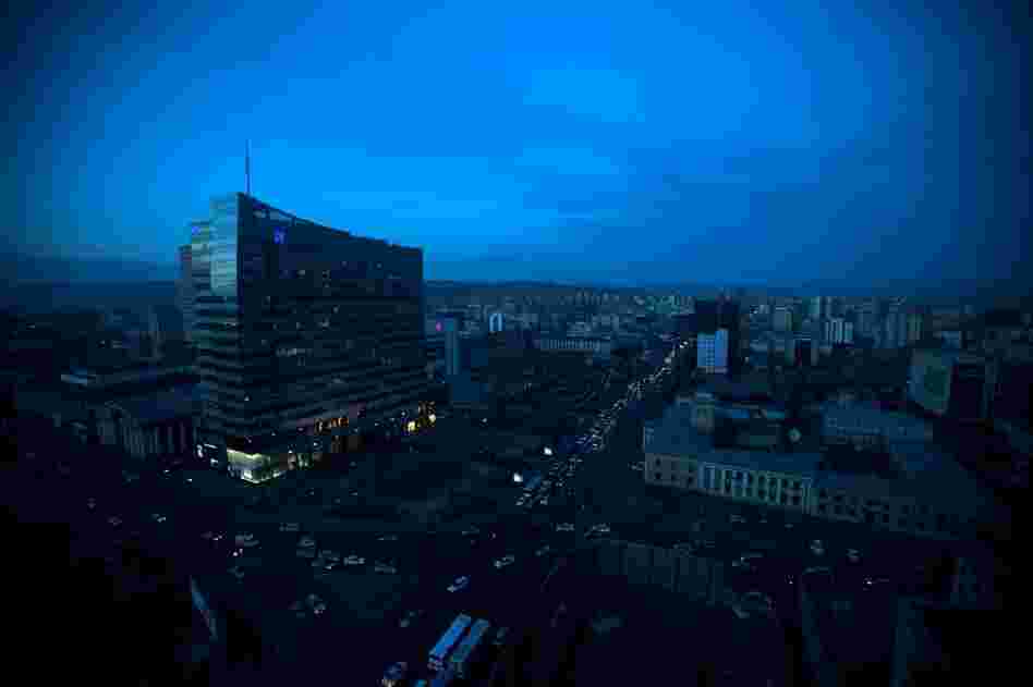 The country's mineral riches — copper, gold and coal — are bringing new wealth to Mongolia. The illuminated storefront at the bottom left is a Louis Vuitton shop in downtown Ulan Bator.