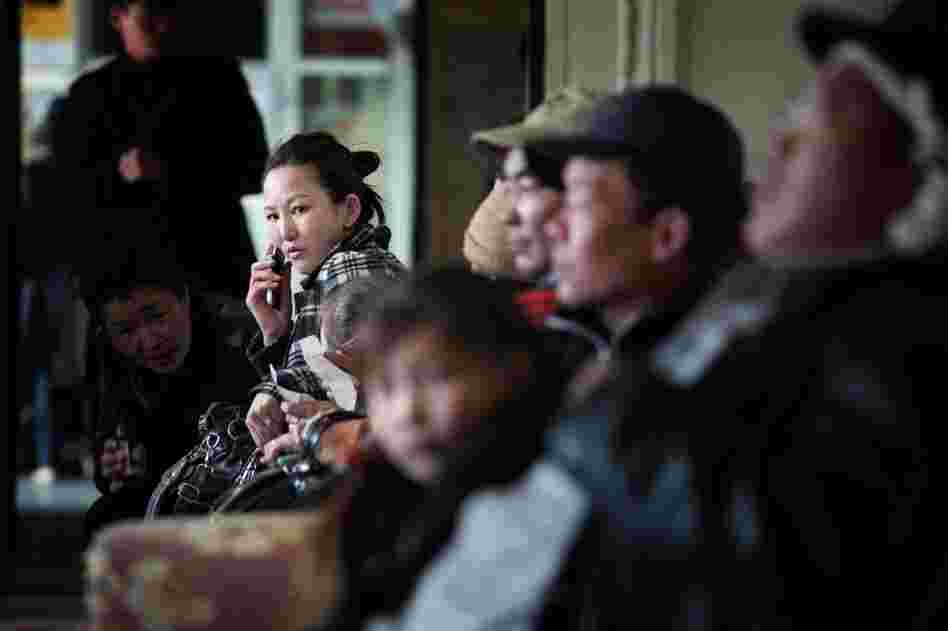 Passengers wait for trains at Ulan Bator's central station. Mongolians are flocking to the mines in search of better-paying jobs.