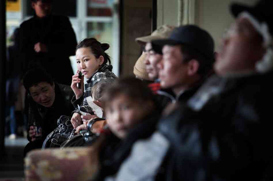 Passengers wait for trains at Ulan Bator's central station. Mongolians are flocking to the mines in search of better-paying jobs.
