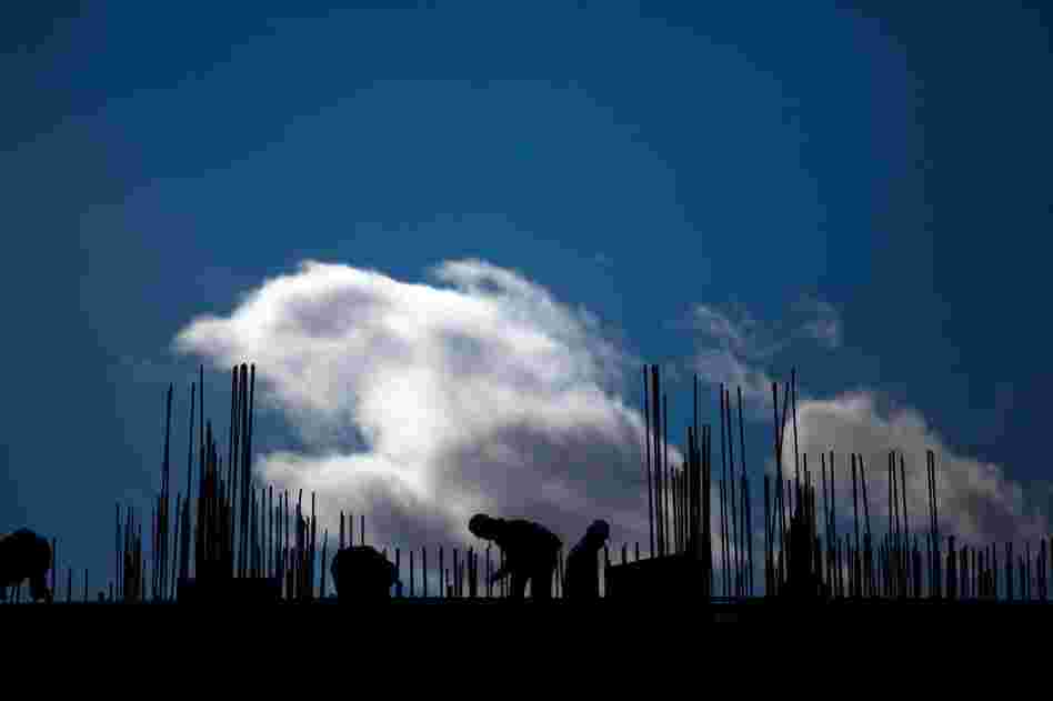 The mining industry is also fueling new construction. Laborers work on a construction site on the outskirts of Ulan Bator.