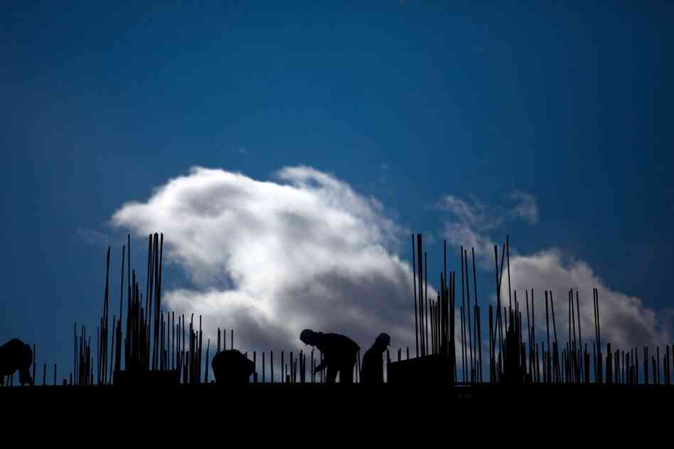 The mining industry is also fueling new construction. Laborers work on a construction site on the outskirts of Ulan Bator.
