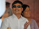 Chinese activist Chen Guangcheng and his wife, Yuan Weijing, arrive at an apartment complex in New York on Saturday. A number of Chinese activists have become far less prominent after leaving their homeland, but Chen hopes to continue his work and remain relevant in China. Chinese activist Chen Guangcheng and his wife, Yuan Weijing, arrive at an apartment complex in New York on Saturday. A number of Chinese activists have become far less prominent after leaving their homeland, but Chen hopes to continue his work and remain relevant in China.