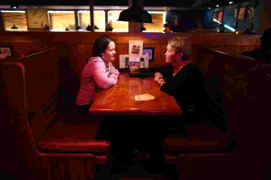 Beckett (left) and her mom Julie go to a restaurant in Cedar Rapids, Iowa, once a week to catch up. Beckett is now famous among children's advocates and travels the country with her mom working for laws and programs in favor of homecare.