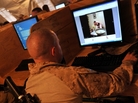 At Forward Operating Base Payne in Afghanistan's Helmand province, Marine Cpl. Jonathan Odriscoll looks at pictures of his sister on Facebook. Troop access to social media has been both a blessing and curse for the military. At Forward Operating Base Payne in Afghanistan's Helmand province, Marine Cpl. Jonathan Odriscoll looks at pictures of his sister on Facebook. Troop access to social media has been both a blessing and curse for the military.