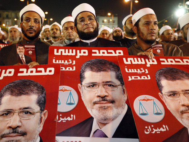 Several hundreds imams listen to Morsi at a rally in Cairo on Sunday.