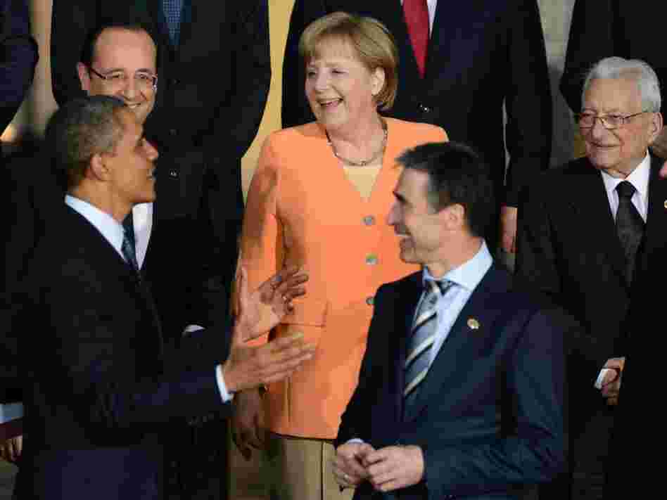 President Obama talks to German Chancellor Angela Merkel, French President Francois Hollande (upper left), NATO Secretary-General Anders Fogh Rasmussen (center) and other leaders during the official photo at Soldier Field in Chicago during the NATO summit Sunday.