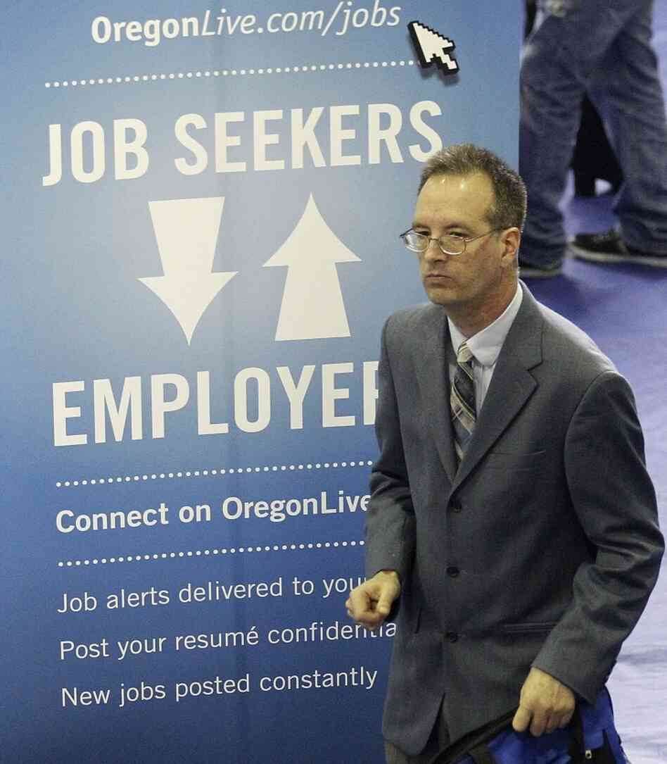 Don Meikle attends an April job fair in Portland, Ore. A new poll shows the economy remains the most important factor for Americans in deciding who to back for president, but with adults split over who would best lead the U.S. economy.