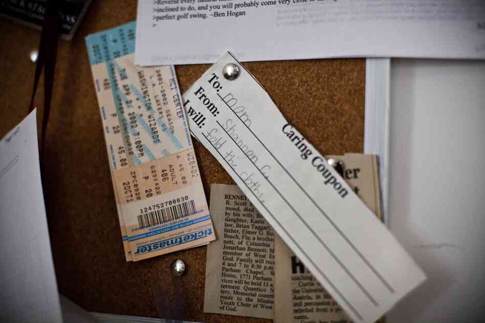 A "caring coupon" given by Shannon to her mother hangs on a bulletin board in Frank's home office.