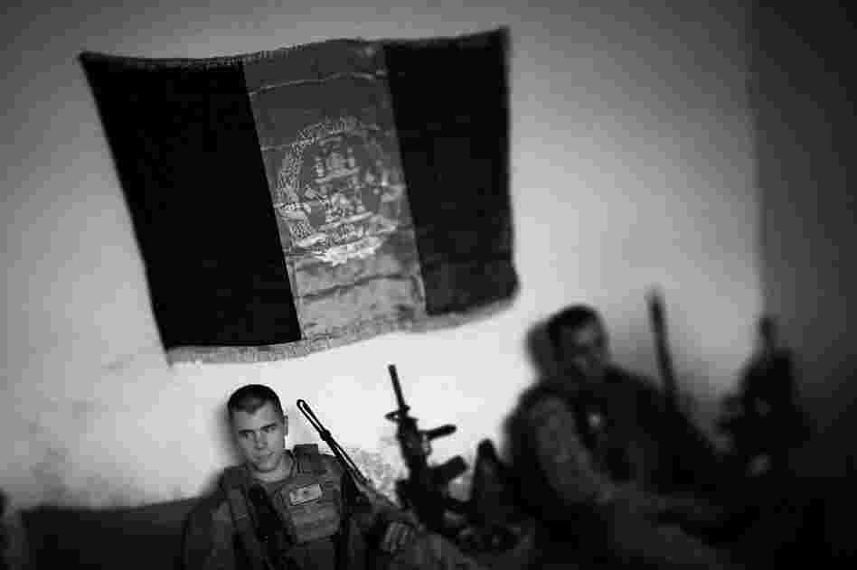Marine 2nd Lt. Jonathan Ross meets Afghan police in the southern district of Marjah, which was previously a Taliban stronghold.