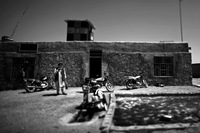 Afghan police officers outside the house that serves as their headquarters. The police form the first level of Marjah's multilevel security structure.
