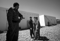 Afghan local police officers wait outside a classroom at a training facility in Marjah. U.S. Marines are training local security forces how to maintain calm in the region.