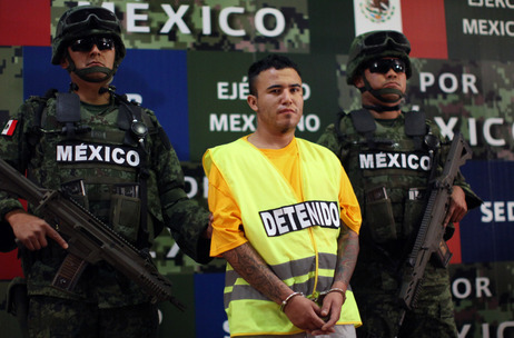 Army soldiers flank Daniel Ramírez, alias Army soldiers flank Daniel Ramírez, alias