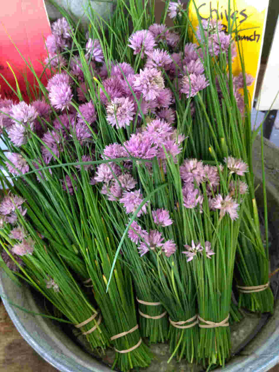 Herb blossoms, such as these chive blossoms from Westminster, Md.-based Gardeners Gourmet at Eastern Market in Washington, D.C., are a colorful addition to this zesty salad. Herb blossoms, such as these chive blossoms from Westminster, Md.-based Gardeners Gourmet at Eastern Market in Washington, D.C., are a colorful addition to this zesty salad.