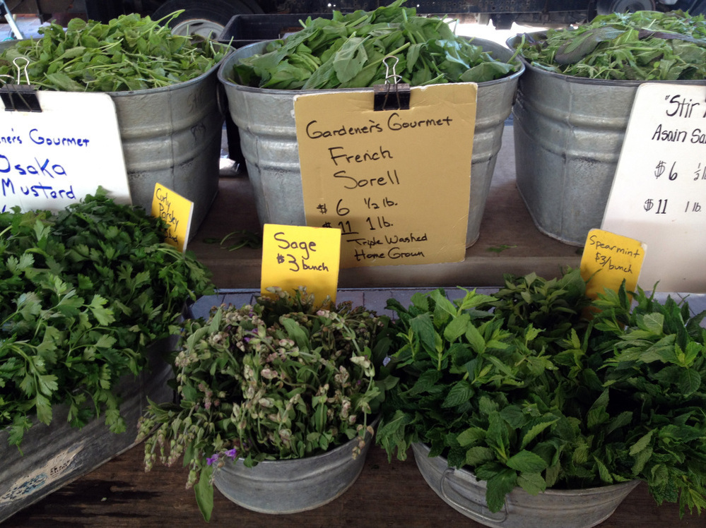 Assorted herbs and greens from Gardeners Gourmet of Westminster, Md., at the Eastern Market in Washington, D.C.