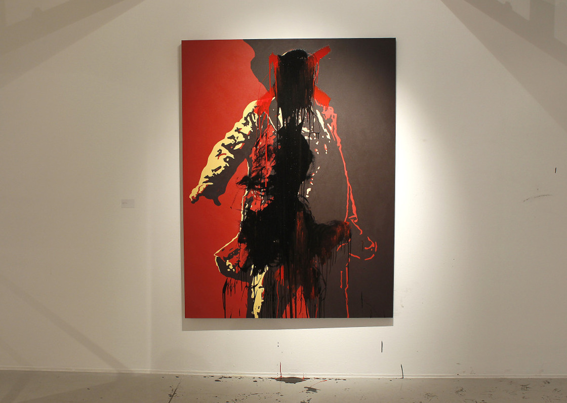 The controversial portrait of South African President Jacob Zuma painted by Brett Murray stands defaced at the Goodman Gallery in Johannesburg, South Africa on Tuesday.
