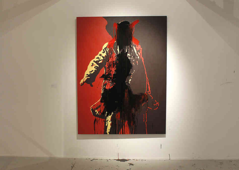 The controversial portrait of South African President Jacob Zuma painted by Brett Murray stands defaced at the Goodman Gallery in Johannesburg, South Africa on Tuesday.